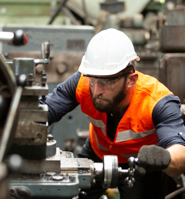 Manufacturing Engineer Operating Machinery at the Factory